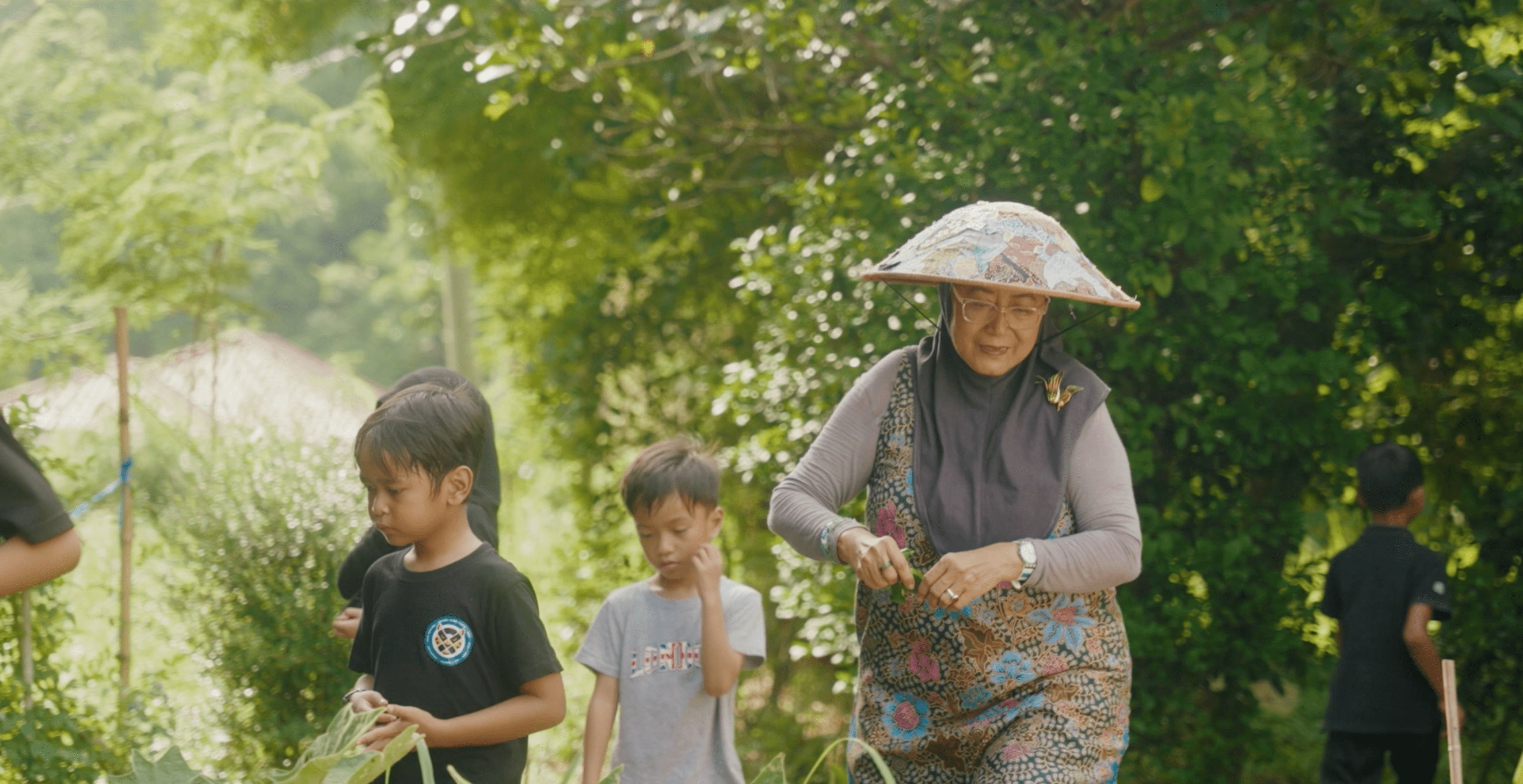a lady accompanying children in a sunny setting